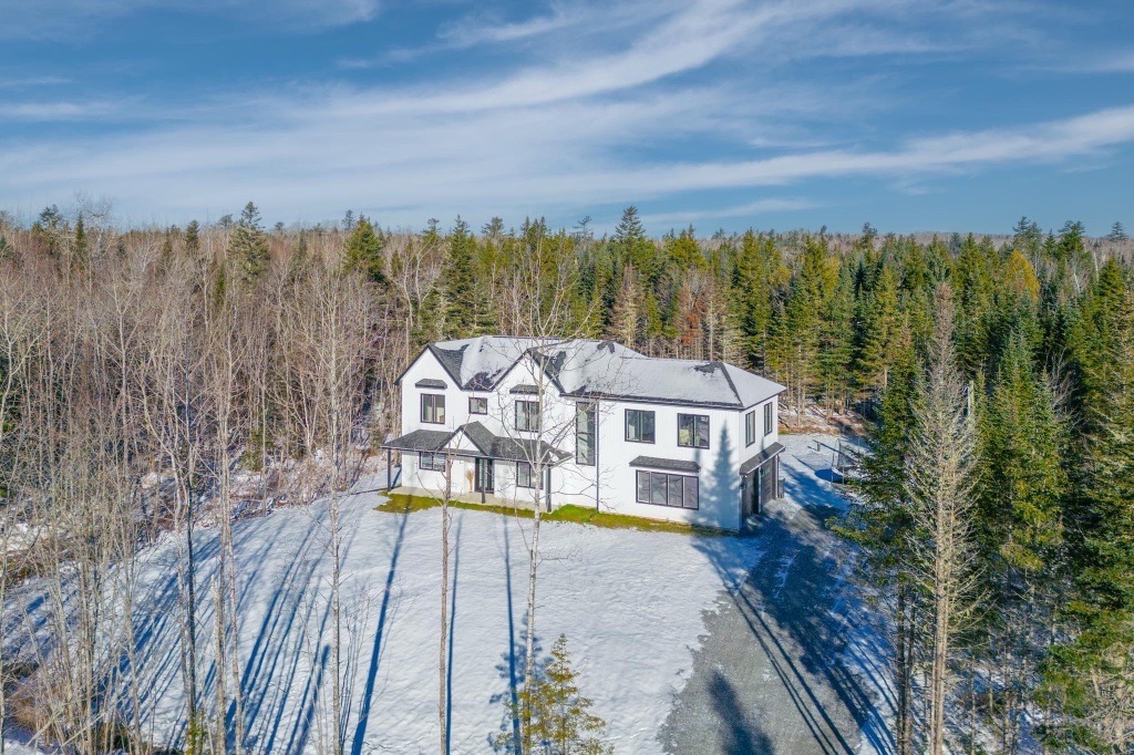 Aerial view of a custom residential home designed by GIY Architecture
